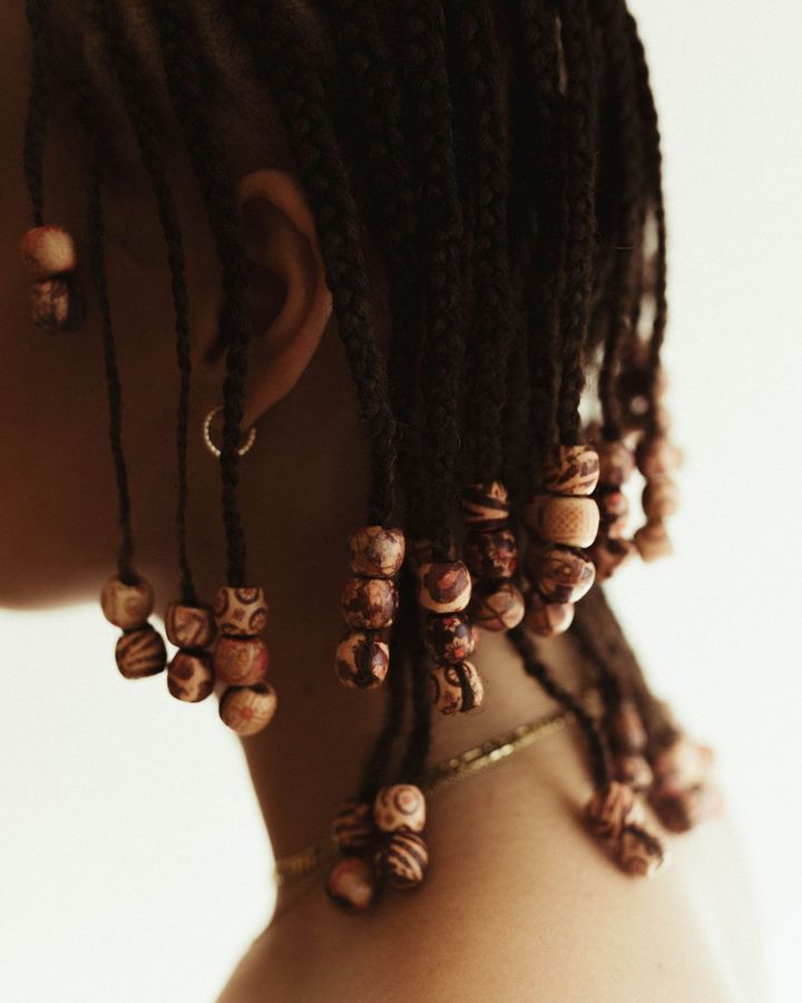 Braids finished with wooden beads