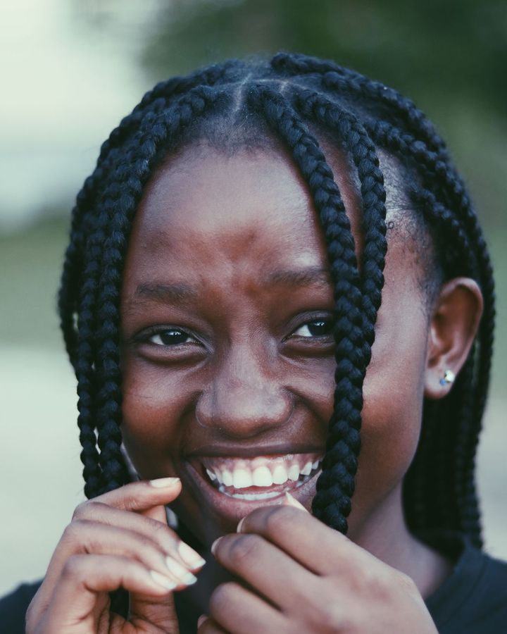 Smiling woman with shoulder-length box braids