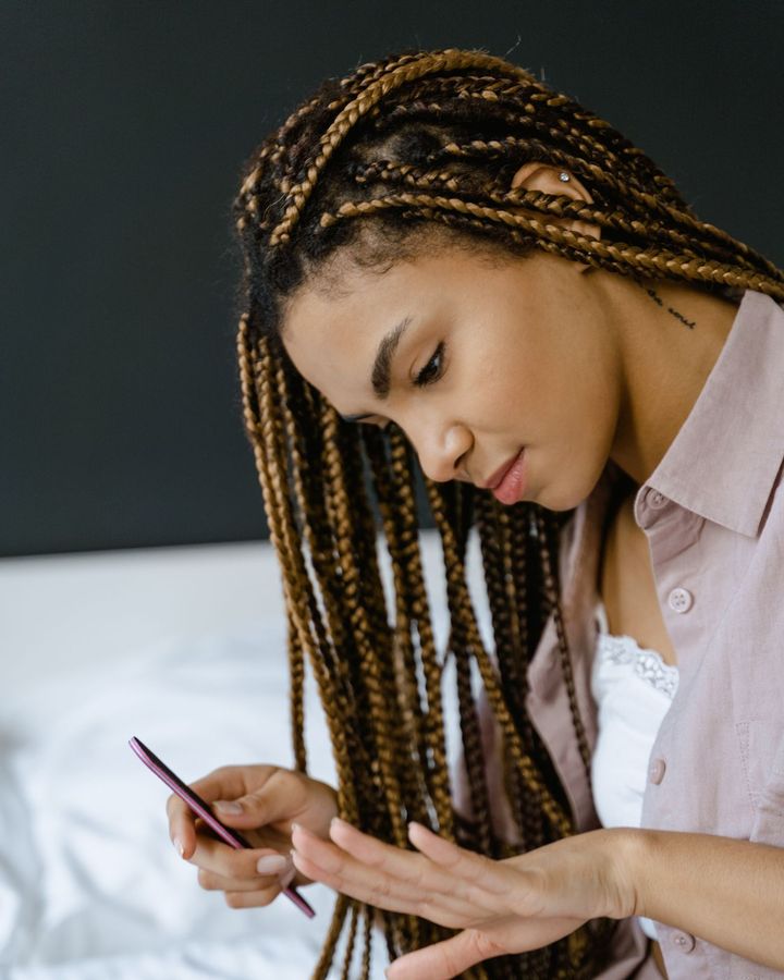 Long knotless braids in a warm brown shade