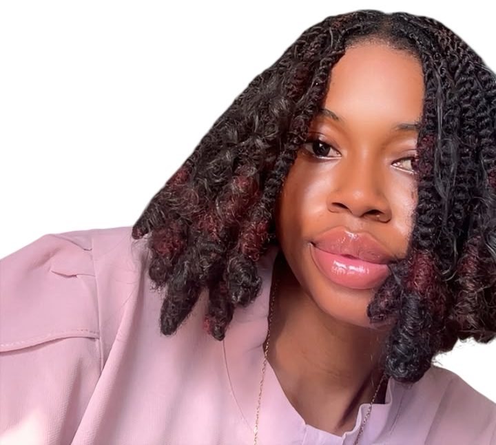 Shariffa, a Pretty Plaits client, smiling in shoulder-length twists with burgundy ends